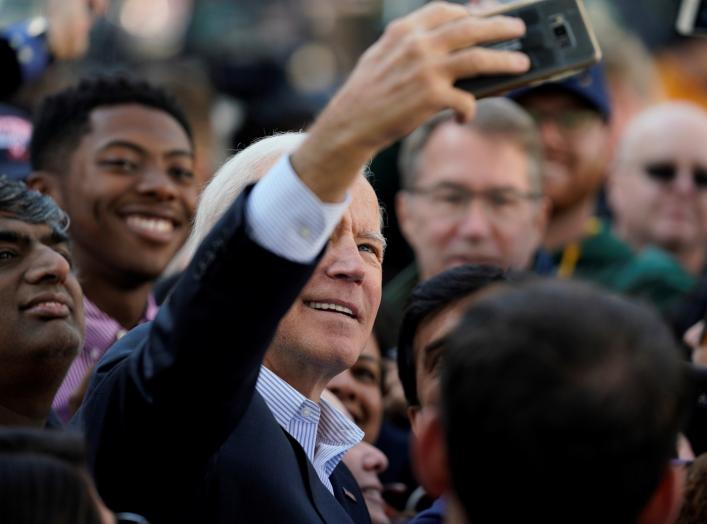 Democratic presidential candidate and former Vice President Joe Biden takes selfies with supporters at a "Get out the Vote" event in Sterling, Virginia, U.S., November 3, 2019. REUTERS/Aaron P. Bernstein