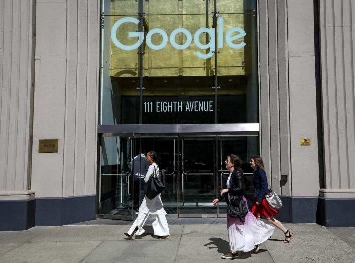 People pass by an entrance to Google offices in New York, U.S., June 4, 2019. REUTERS/Brendan McDermid/