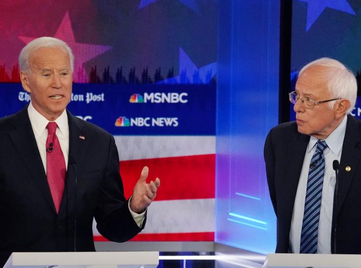 Democratic presidential candidate former Vice President Joe Biden speaks as Senator Bernie Sanders listens during the fifth 2020 campaign debate at the Tyler Perry Studios in Atlanta, Georgia, U.S., November 20, 2019. REUTERS/Brendan McDermid