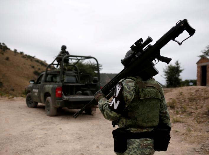 Soldiers assigned to the National Guard are seen while giving protection for the caravan of relatives on their journey to bury Rhonita Miller-Lebaron and Dawna Ray Langford and their children who were killed by unknown assailants, in Bavispe, Sonora state