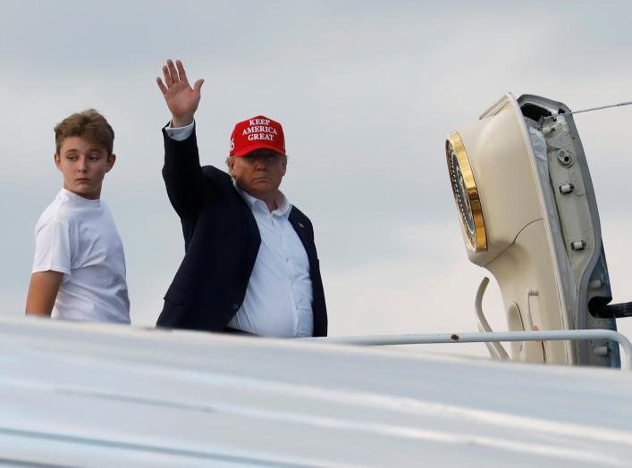 U.S. President Donald Trump and his son Barron board Air Force One en route to Washington after a Thanksgiving vacation, at Palm Beach International Airport in Florida, U.S., December 1, 2019. REUTERS/Yuri Gripas