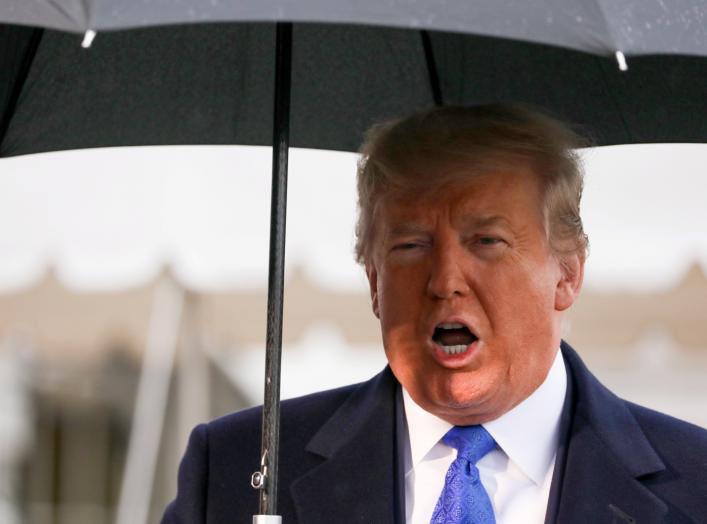 U.S. President Donald Trump speaks to reporters as he and first lady Melania Trump depart for travel to a NATO summit in London, from the White House in Washington, U.S. December 2, 2019. REUTERS/Jonathan Ernst