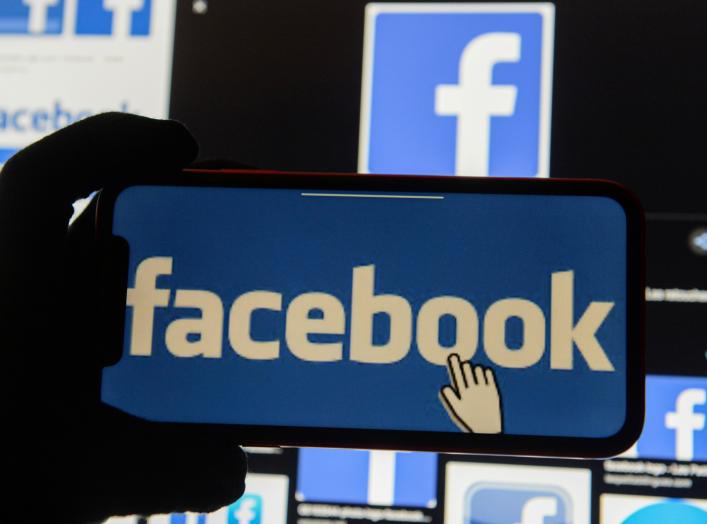 The Facebook logo is displayed on a mobile phone in this picture illustration taken December 2, 2019. REUTERS/Johanna Geron