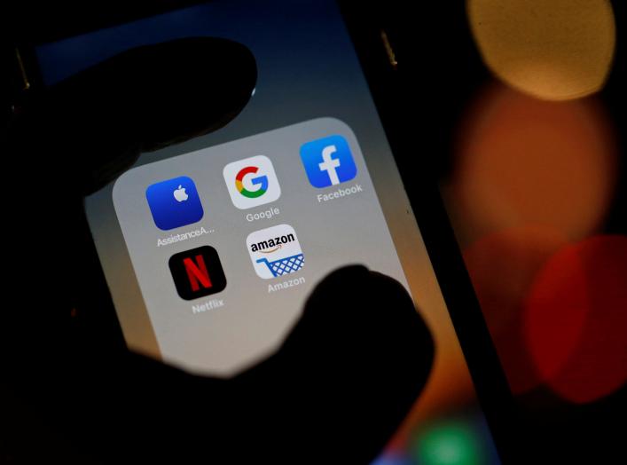 The logos of mobile apps, Google, Amazon, Facebook, Apple and Netflix, are displayed on a screen in this illustration picture taken December 3, 2019. REUTERS/Regis Duvignau