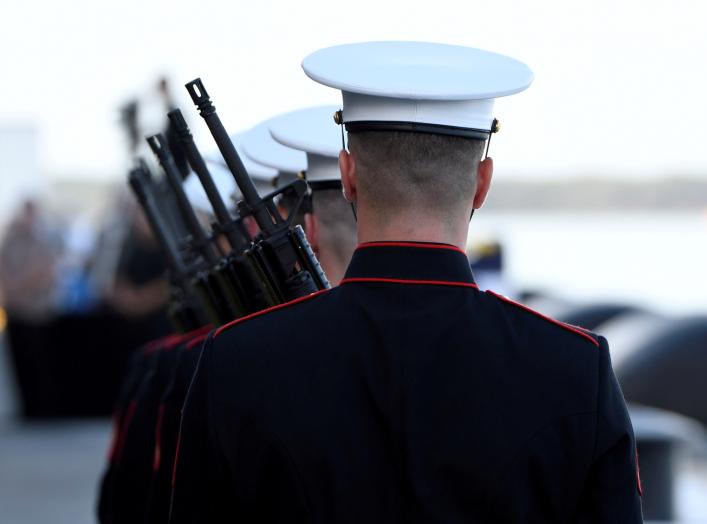 U.S. Marines prepare for the "Rifle Salute" during ceremonies marking the 75th anniversary of the attack on Pearl Harbor at Kilo Pier on Joint Base Pearl Harbor - Hickam in Honolulu, Hawaii December 7, 2016. REUTERS/Hugh Gentry