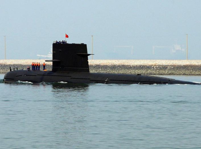 A Chinese navy submarine leaves Qingdao Port, Shandong province April 22, 2009. China will show off its resurgent naval strength this week at a parade marking 60 years since the founding of its navy, presenting its fleet of warships and nuclear submarines