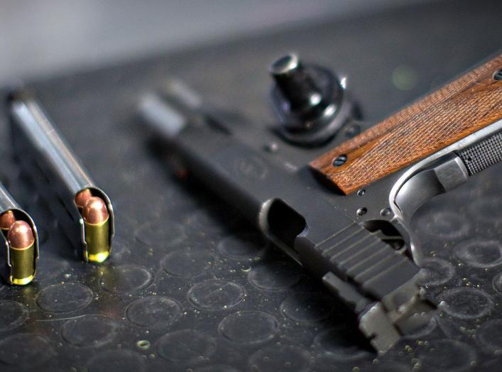 A 9mm pistol and ammunition sits ready for the next customer at the DVC Indoor Shooting Centre in Port Coquitlam, British Columbia March 22, 2013. REUTERS/Andy Clark (CANADA)