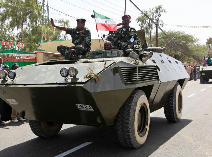 Somaliland troops sit on an armoured personnel carrier during a parade to mark the 22nd anniversary of Somaliland's self-declared independence from the larger Somalia, in Hargeisa May 18, 2013. REUTERS/Feisal Omar (SOMALIA - Tags: ANNIVERSARY POLITICS SOC