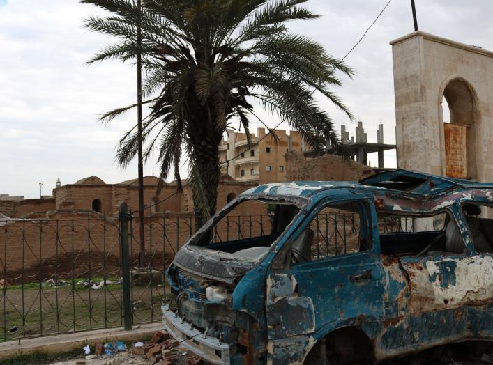 Image by Samuel Sweeney taken in Raqqa on December 11, 2018. A bombed van in front of Qasr al-Banat, a historic site in Raqqa dating to Harun al-Rashid's caliphate which also used Raqqa as its capital, from 796 to 809 AD. 