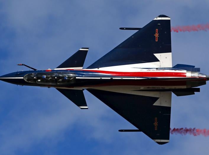 A China's J-10 fighter jet from the People's Liberation Army Air Force August 1st Aerobatics Team performs during a media demonstration at the Korat Royal Thai Air Force Base, Nakhon Ratchasima province, Thailand, November 24, 2015. Thailand's military he