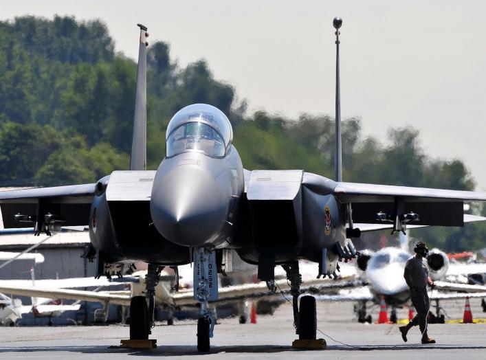 A crew chief from the 391st Aircraft Maintenance Unit finishes checking an F-15E Strike Eagle from the 391st Fighter Squadron before it performs at the Seafair Hydroplane Races and Air Show in Seattle July 30 through Aug. 2, 2010. 