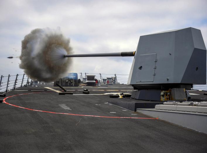 The Arleigh Burke-class guided-missile destroyer USS Bainbridge (DDG 96) fires its Mark 45 five-inch gun during a live-fire exercise. Bainbridge, homeported at Naval Station Norfolk, is conducting naval operations in the U.S. 6th Fleet area of operations