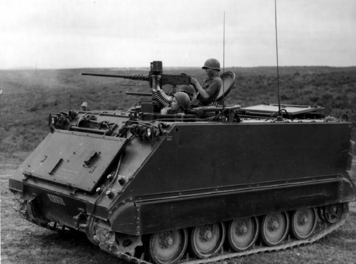 M113 firing .50-caliber machine gun during South Vietnamese training exercise. Barrel of side-mounted .30-caliber machine gun can be seen on far side of M113.