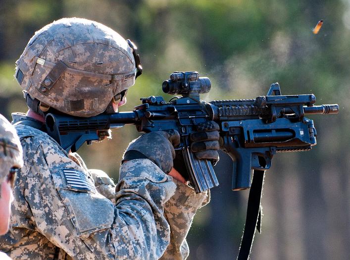 Army Pvt. Brian Spedding fires at a pop-up target during the Bandit Blitz team competition on Fort Bragg, N.C., Dec. 1, 2011. Spedding is an artilleryman assigned to the 82nd Airborne Division's 1st Brigade Combat Team