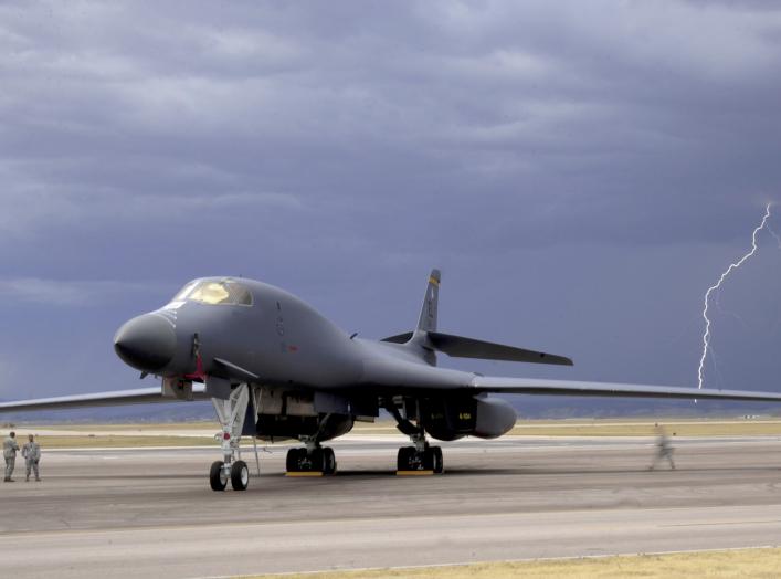 ELLSWORTH AIR FORCE BASE, S.D. - Lightning strikes behind a B-1B Lancer during an evening thunderstorm, Sept. 9. The 28th Bomb Wing maintains a fleet of 28 B-1s.