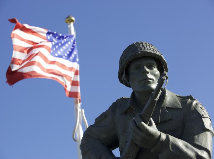 The statue of Maj. Dick Winters of Easy Company, 506th Parachute Infantry Regiment, 101st Airborne Division, stands as reminder of the sacrifice of the Greatest Generation near Utah Beach, Normandy, France, June 7, 2015. Over 380 service members from Euro