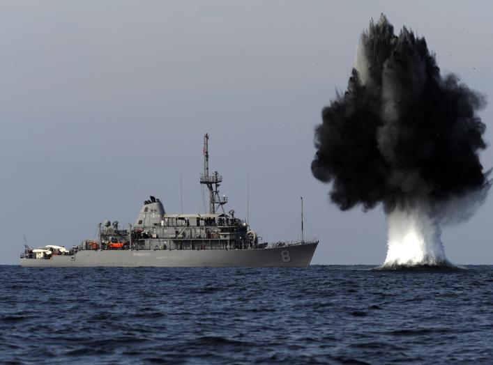 STRAIT OF HORMUZ (Nov. 19, 2010) A demolition charge detonates 1,500 meters from the Avenger-class mine countermeasures ship USS Scout (MCM 8).