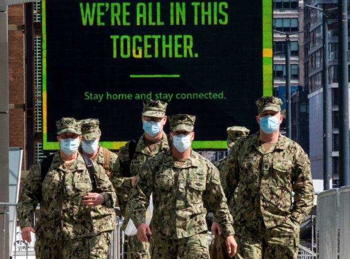 U.S. military personnel wearing face masks arrive at the Jacob K. Javits Convention Center, as the outbreak of the coronavirus disease (COVID-19) continues, in the Manhattan borough of New York City, New York, U.S., April 7, 2020. REUTERS/Eduardo Munoz TP