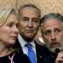 Comedian/director Jon Stewart (R) answers a question at an event to urge U.S. lawmakers to re-authorize the Zadroga Bill at the U.S. Capitol in Washington September 16, 2015. Senators Kirsten Gillibrand (D-NY) (L) and Charles Schumer (D-NY) (C) listen in.