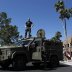 A Maricopa County, Arizona police SWAT team with an armored vehicle stand guard outside a campaign rally being held by Republican U.S. presidential candidate Donald Trump in Fountain Hills, Arizona March 19, 2016. REUTERS/Ricardo Arduengo