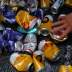 A recycled waste collector picks up beer cans during carnival block party “Unidos do Swing” in Sao Paulo, Brazil, February 24, 2020. REUTERS/Amanda Perobelli