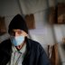 Kevin Keeley, who has been homeless for eight months and may have come in contact with someone with coronavirus disease (COVID-19), poses for a portrait outside a quarantine tent run by Boston Health Care for the Homeless in Boston, Massachusetts, U.S., A