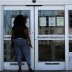 A woman looks for information on the application for unemployment support at the New Orleans Office of Workforce Development, as the spread of coronavirus disease (COVID-19) continues, in New Orleans, Louisiana U.S., April 13, 2020. REUTERS/Carlos Barria