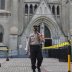 A policeman, part of a large-scale task force enforcing social restrictions amid the coronavirus disease (COVID-19) outbreak, walks with a face mask outside a church on the first day of its reopening, in Jakarta, Indonesia, July 12, 2020. REUTERS/Ajeng Di