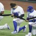 Jul 24, 2020; Arlington, Texas, USA; Texas Rangers designated hitter Shin-Soo Choo (17) and his teammates kneel before the game against the Colorado Rockies at Globe Life Field. Mandatory Credit: Tim Heitman-USA TODAY Sports