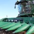 A farmer's corn harvesting combine is seen during the corn harvest as farmers struggle with the effects of weather and ongoing tariffs resulting from the trade war between the United States and China that are effecting their agricultural business in Eldon