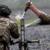 U.S. Military Academy (USMA) cadets wear protective face masks as they fire live mortar shells from an artillery weapon during tactical and physical training activities as part of Cadet Summer Training at West Point, New York, U.S., August 7, 2020. REUTER