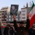 A man holds a picture of late Iranian Major-General Qassem Soleimani, as people celebrate in the street after Iran launched missiles at U.S.-led forces in Iraq, in Tehran, Iran January 8, 2020. Nazanin Tabatabaee/WANA (West Asia News Agency) via REUTERS