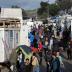 Refugees and migrants make their way inside the Moria camp, on the island of Lesbos, Greece, November 27, 2019. REUTERS/Elias Marcou