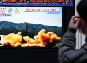 A man looks at a street monitor showing a news report about North Korea's missile launch, in Tokyo, Japan, November 29, 2017. REUTERS/Toru Hanai